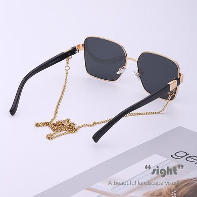 Сонцезахисні окуляри з ланцюжком Beauty чорні із золотом фото