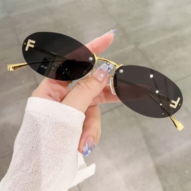 Сонцезахисні окуляри без оправи Fantasy чорні із золотом фото