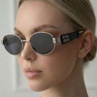 Солнцезащитные очки овальные Miu Miu Oval Graphite черные с серебром фото