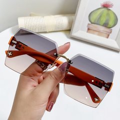 Солнцезащитные очки без оправы Section градиент серые с оранжевым фото